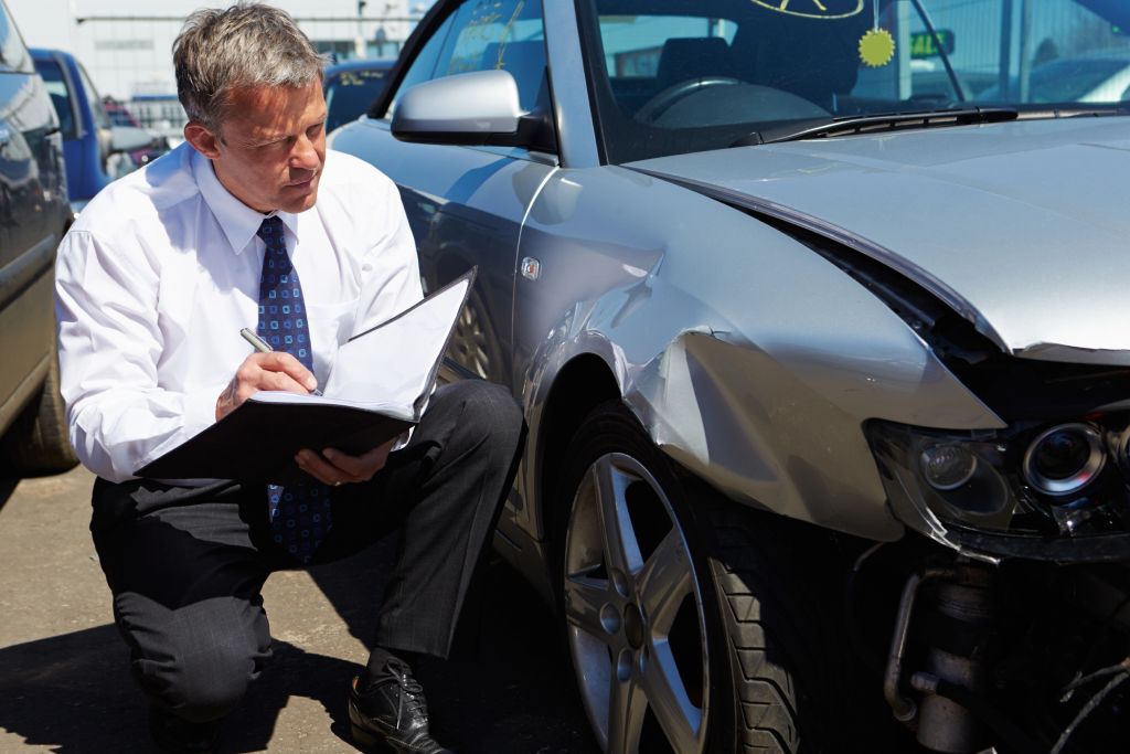 Legal consultation after an at-fault car accident in Arizona Arizona accident victim meeting with personal injury attorney to discuss claim strategy