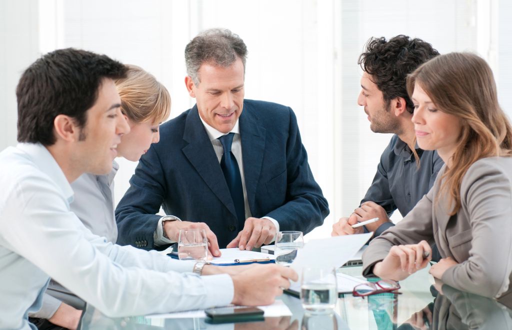 Lawyers Statue Person writing on a paper next to a lawyers statue