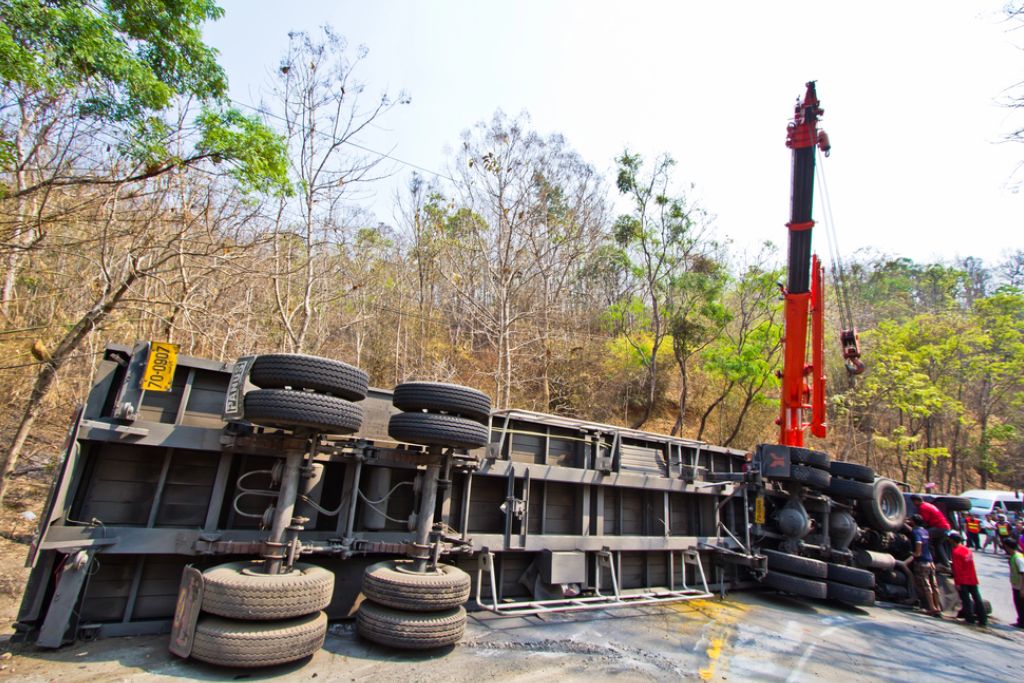 Damaged white truck Damaged white truck with a semi-trailer