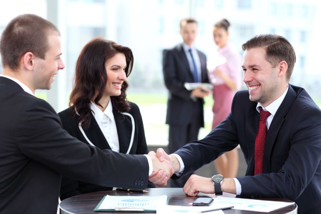 Shake hands after a successful meeting